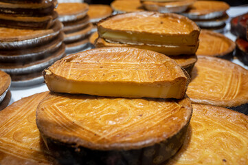 Sweet dessert of Basque Country, baked cheese cake with topping for sale on market in San...
