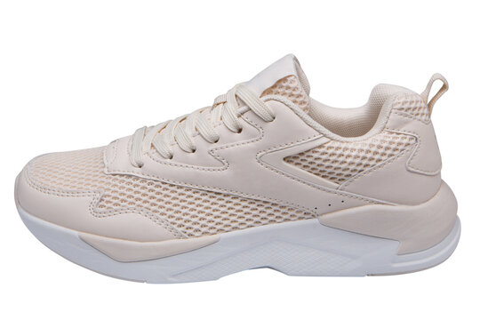 One beige sneaker made of mesh fabric and leather, with a thick sole, on a white background, isolate