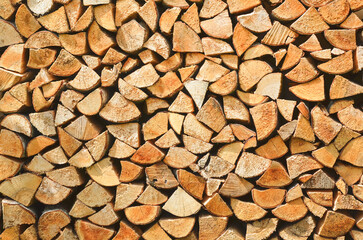 Firewood background. Preparation of firewood for the winter. Pile of firewood.