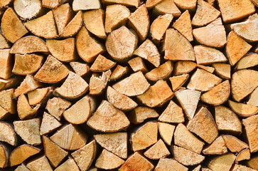 Firewood background. Preparation of firewood for the winter. Pile of firewood.