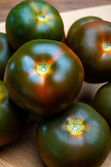 Fresh ripe sweet reddish brown and green kumato tomatoes