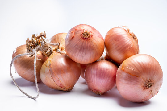 Bunch of french AOP pink onions from Roscoff village in Brittany, France