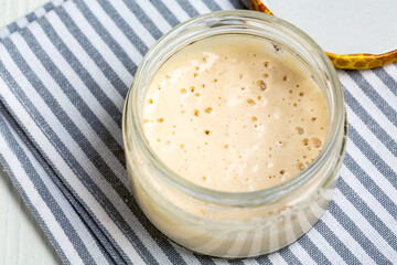 Mature sourdough in jar.