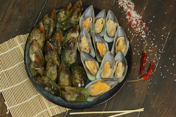 green mussel clam in shell closeup photo