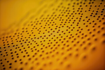 abstract yellow material with holes for background