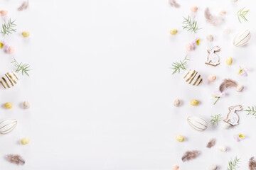 Festive Easter frame from small easter eggs on white background. Stylish easter flat lay