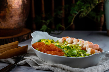 Winter salad: Shredded brussels sprouts salad with poached shrimp and orange supremes.