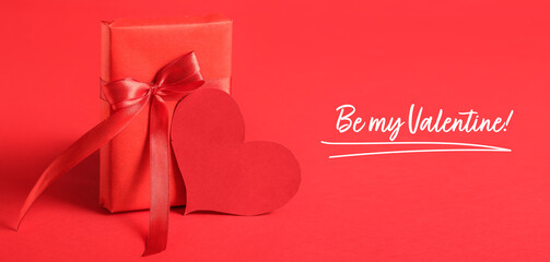 Greeting card for Valentine's Day with gift and heart on red background