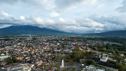 Fototapeta na wymiar Aerial view of Jam Gadang, a historical and most famous landmark in BukitTinggi City, an icon of the city and the most visited tourist destination by tourists.