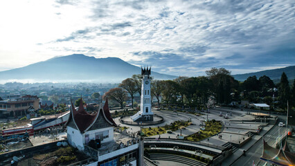 Naklejka premium Aerial view of Jam Gadang, a historical and most famous landmark in BukitTinggi City, an icon of the city and the most visited tourist destination by tourists.
