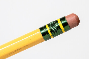 Macro closeup of aged worn pencil eraser isolated white background