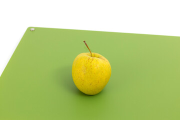 Apple on green professional chopper isolated