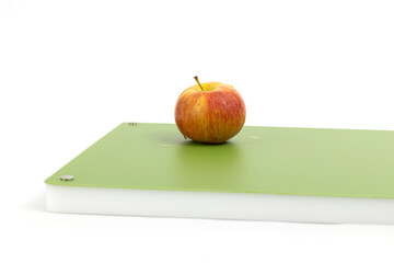 Apple on green professional chopper isolated