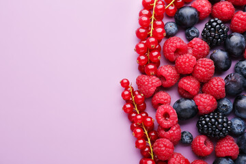 Heap of fresh ripe berries on color background