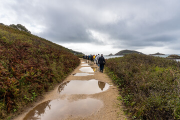 Herm Island, Guernsey, UK: Hikers on the car free island and popular British Isles holiday...