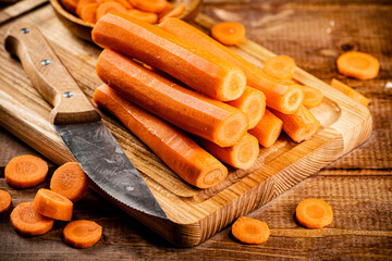Fresh carrots on a cutting board. 