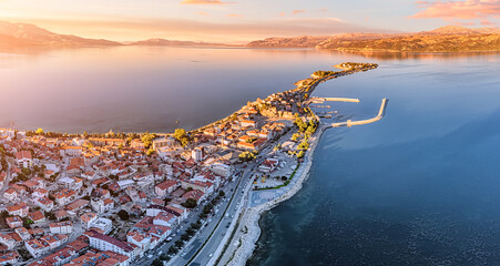 Aerial sunset view of Egirdir lake peninsula and town in Isparta region. Calm turquoise and scenic coast of national park in Turkey - obrazy, fototapety, plakaty