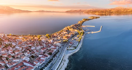 Foto op Canvas Aerial sunset view of Egirdir lake peninsula and town in Isparta region. Calm turquoise and scenic coast of national park in Turkey © EdNurg