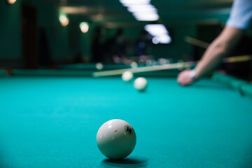 Sports game of billiards on a green cloth