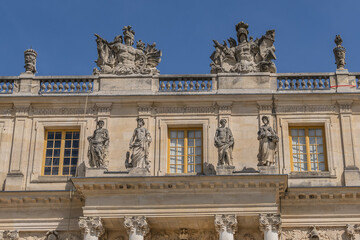 Fototapeta na wymiar External view of architectural fragments of Chateau de Versailles (Palace of Versailles) near Paris: Palace Versailles was a royal chateau. Versailles, Paris, France.
