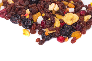 wooden background in retro style. a mixture of dried fruits lies on it. close-up. there is a...