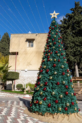 NAZARETH, ISRAEL. December 27, 2022. Festive Nazareth, people on the streets, large Christmas tree...