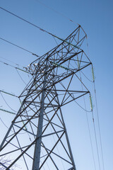 Electircity pylons against a clear blue sky on a cold winters day in staffordshire