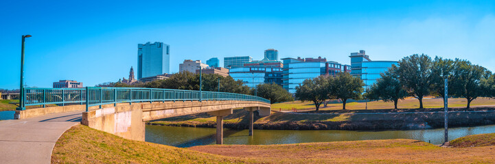 Fort Worth panoramic city skyline and building architecture over Trinity River, cityscape with...