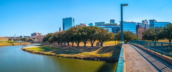 Fort Worth panoramic city skyline, buildings, and walking trails over the Trinity River Bridge, a...