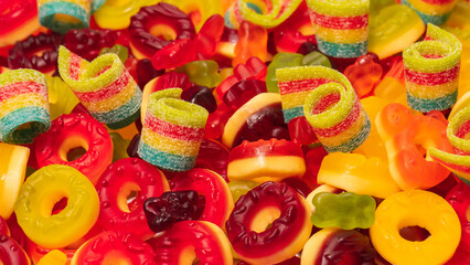 Obraz na płótnie Canvas Assorted colorful gummy candies. Top view. Jelly donuts.