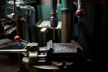 Part machining with drilling machine