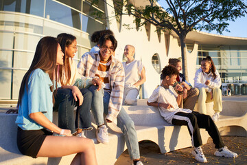 Fototapeta premium Happy group of young millennial people having fun together outdoors. High quality photo
