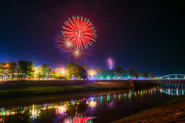 Beautiful Fireworks and light Chan Palace bridge over the Nan River New Landmark It is a major tourist is Public places attraction Phitsanulok,Thailand,Twilight sunset.