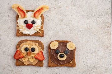 Funny animal faces toasts for kids lunch