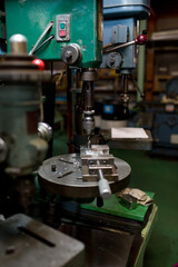 Part machining with drilling machine