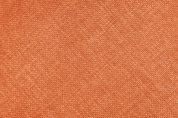 Jacquard woven upholstery, orange coarse fabric texture with diagonal weave lines. Textile...