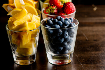 Strawberries, blueberries, lemons, limes, oranges and pineapple. Cooking ingredients from a farmers markets, Fresh Fruits and vegetables. Classic ingredients and garnishes used in restaurant cooking.