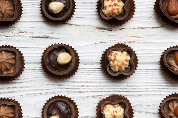 Different kinds of chocolates on colored table close-up. Top View and Flat Lay