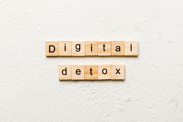 Digital Detox word written on wood block. Digital Detox text on table, concept