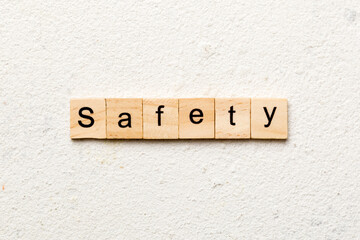 safety word written on wood block. safety text on cement table for your desing, concept