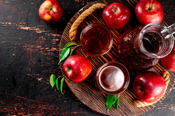 Apple juice on a wooden tray. 