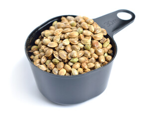 Heap of hemp seeds isolated on white background