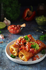 A typical dish of Mexican cuisine - Chimichanga, made of tortilla with different ingredients