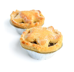 Cranberry and chocolate mince pies isolated on white background