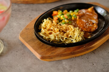 close-up of a bowl of soba noodles with sliced roast beef steak. Asian cuisine