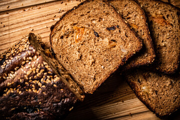 Fresh bread with dried fruits on a cutting board. 