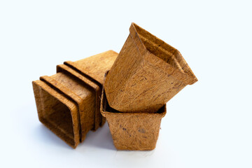 Coco coir pots on white background.