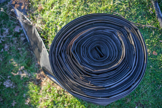 Rolled tape of flexible irrigation tubing system