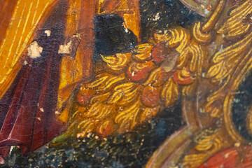 Icon painted in the byzantine or orthodox style, Ancient Greek inscription, close up, details. Old paintings, museum art in Greece, Crete.