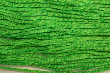 A handfull of green embroidery thread calls to mind spring grasses and sunny days.